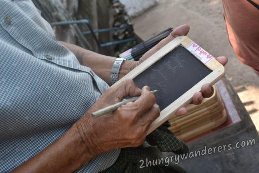 Mr Anthony demonstrating a writing slate Mr Anthony demonstrating a writing slate