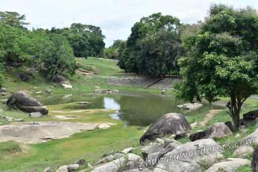 The wall of the pond still has the original stones The wall of the pond still has the original stones